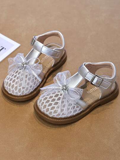 1 Đôi dép xăng đan thời trang dễ thương cho bé gái sơ sinh/trẻ nhỏ, hàng mới về mùa hè, trang trí nơ và đá lấp lánh, dép đế bằng chống trượt bằng chất liệu PU, dép xăng đan thoải mái, đa năng, thích hợp mang ở nhà hoặc đi biển.