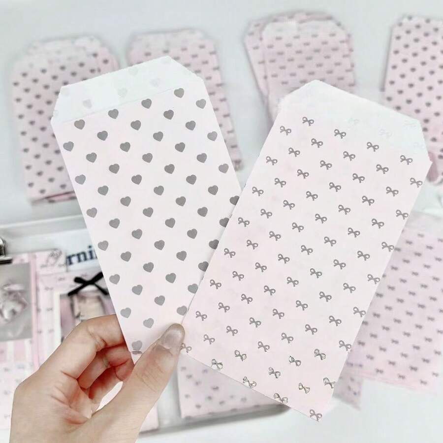 200 túi đựng quà tặng ngày lễ kích thước 3.1x5.9 inch, bao gồm túi giấy đựng quà cao cấp, túi quà trang trí, túi giấy họa tiết trái tim và nơ màu hồng, túi đựng quà dày dặn, túi giấy đựng quà trang trí DIY sáng tạo, thích hợp cho các lễ hội, đám cưới, sinh nhật, tiệc tùng, túi đựng quà và các loại túi đựng quà khác. - túi quà - Xem 1
