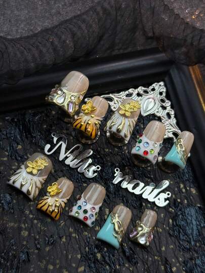 10pcs Handmade Fully Covered Short Duck Nails Acrylic Kit, White Nails, Orange&White Tie Dye, White&Mint Blue French Nails, Using Gold For Hand Drawn Asymmetrical Geometric Patterns, Hand Drawn Black Zebra Stripes, 3D Red&Green&Blue Small Rhinestones, Three-Dimensional Gold Butterflies&Flowers&Asymmetrical Shaped Rhinestones And Other Nail Accessories.