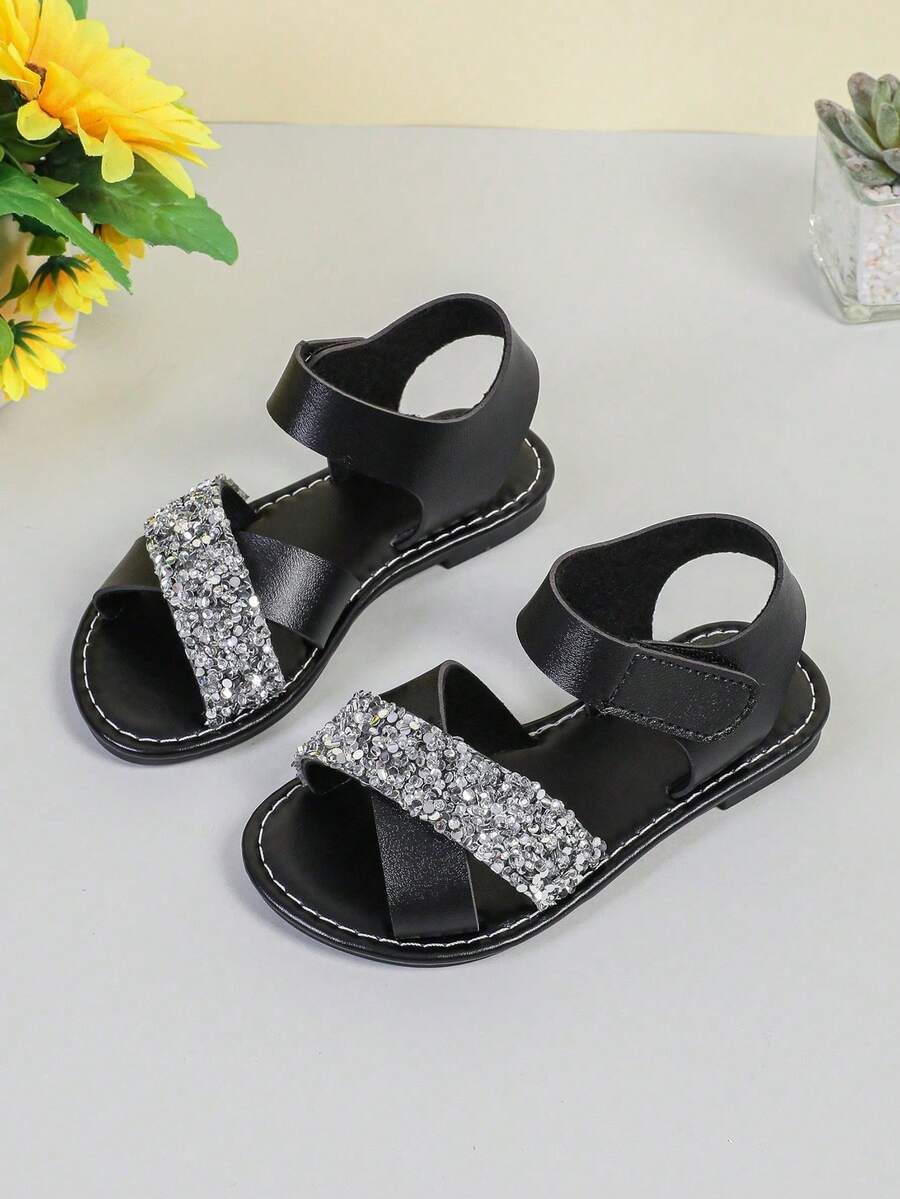1 đôi dép xăng đan đế bằng màu đen cho bé gái, có đính kim tuyến bạc, dép công chúa đính pha lê lấp lánh cho trẻ em, giày đế mềm hở mũi thoải mái cho trẻ mới biết đi và trẻ nhỏ, thích hợp cho mùa hè. - màu đen - Xem 1