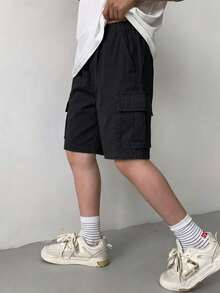 1 pieza Pantalones cortos cargo casuales y modernos con bolsillos grandes para niño pequeño, pantalones cortos Bermuda sueltos y relajados - Negro - Ver 3
