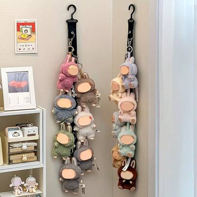 1个白色尼龙收纳盒及整理架 - 悬挂式收纳展示架，可壁挂或门挂，适用于婴儿房收纳，设计紧凑节省空间，材质耐用，适合家居装饰和节日礼品