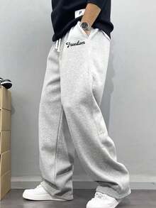 Men's Casual Sweatpants, Loose Straight-Leg Fit, Comfortable Drape, Suitable For Lounging And Outdoor Activities. Also Makes A Great Couples Gift. Made Of 100% Polyester Fabric With Drawstring Waistband For Adjustable Fit, Available In Multiple Colors. - Light Grey - View 1