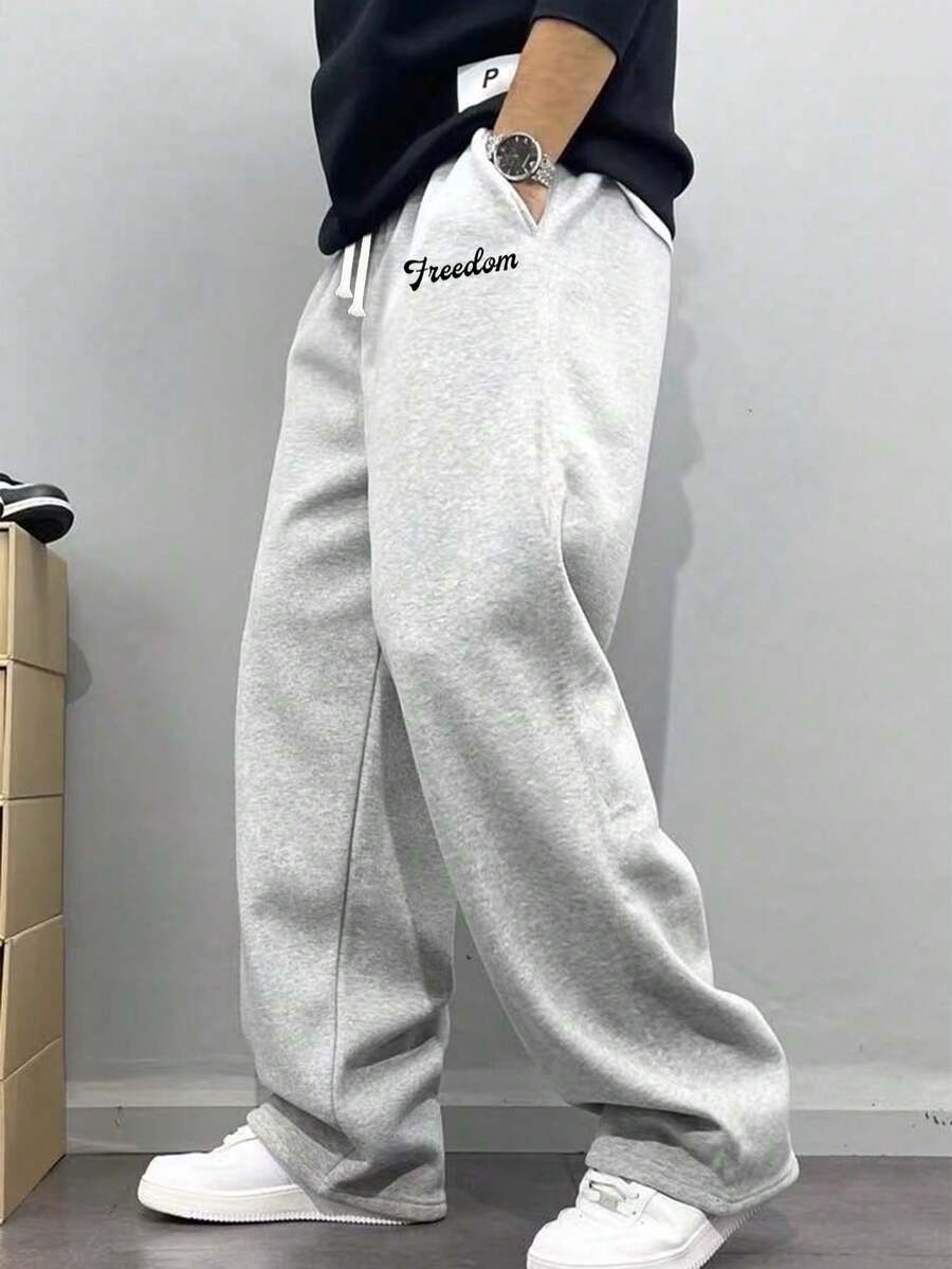 Men's Casual Sweatpants, Loose Straight-Leg Fit, Comfortable Drape, Suitable For Lounging And Outdoor Activities. Also Makes A Great Couples Gift. Made Of 100% Polyester Fabric With Drawstring Waistband For Adjustable Fit, Available In Multiple Colors. - Light Grey - View 1