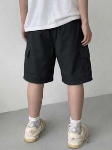 1 pieza Pantalones cortos cargo casuales y modernos con bolsillos grandes para niño pequeño, pantalones cortos Bermuda sueltos y relajados - Negro - Ver 2
