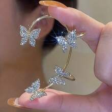 Pendientes de mariposa con rhinestones brillantes, joyas para orejas sin perforar, clips para hueso de la oreja, pendientes de clip para mujeres, pendientes de cristal exquisitos para fiestas y eventos de baile - Dorado - Ver 6