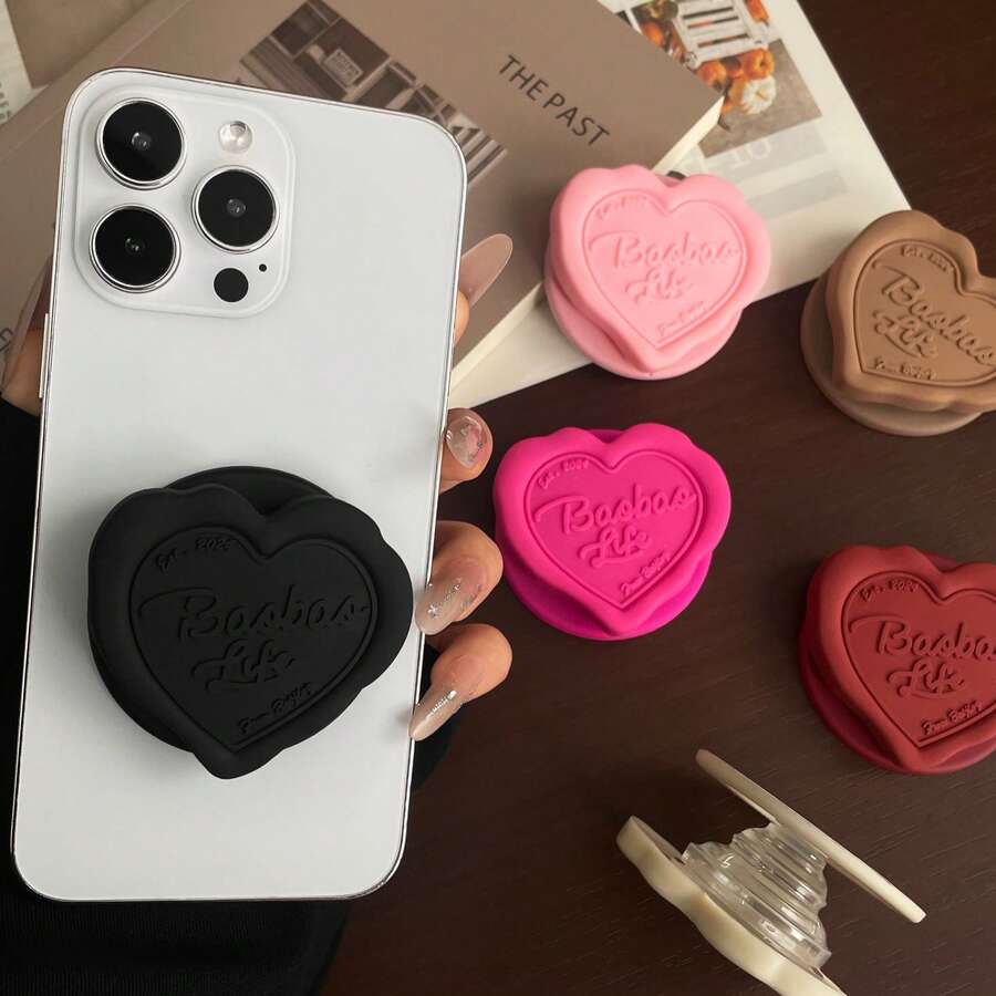 1个心形磁吸伸缩手机支架，可爱可伸缩吸盘手机支架，创意便携新款设计