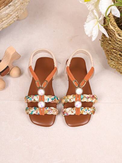 1 par de sandalias de princesa de estilo europeo y americano para el verano, zapatos de playa de suela blanda y antideslizante para niñas, zapatillas de tacón bajo con decoración de diamantes de colores trenzados para niños y niñas, adecuadas para la escuela, actividades al aire libre y uso diario
