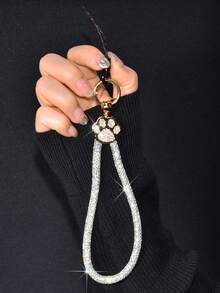 1 pièce Dragonne de téléphone de luxe pour femme en alliage brillant avec strass. Charm en métal avec empreinte de patte de chat sertie de cristaux strass amovible. Dragonne poignet créative et personnalisée, idéale comme porte-clés de voiture pour les voyages, le shopping, les cadeaux de printemps, anniversaire - Multicolore - Voir 11