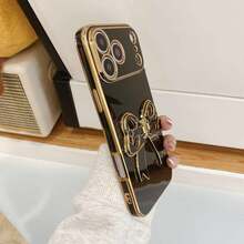 Tặng kèm dây đeo cổ tay khi mua hàng, ốp lưng điện thoại kiểu nơ có chân đế + dây đeo cổ tay, tương thích với iPhone 17 Pro Max/16 Pro Max/15 Pro Max/14 Pro Max/13 Pro Max/12 Pro Max/11 Pro Max/XS Max/7/8 Plus, tương thích với Samsung S26/25 24 32 1u, tương thích với , Honor. - màu đen - Xem 4