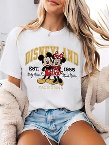 Disney-Style Women's Printed T-Shirt Featuring Classic 1955 Cartoon Prints Of Mickey And Minnie Mouse. This Round-Neck Summer Top Is Crafted From Soft, Comfortable 100% Cotton Fabric, Perfect For Everyday Wear, Outdoor Activities, Or Shopping. It Also Makes An Ideal Choice For Women's Vacation Wear. - trắng - Xem 1