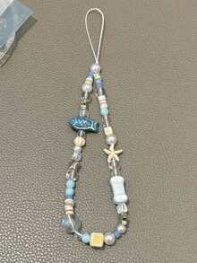 1 pieza Cordón para teléfono hecho a mano con cuentas de pez y estrella de océano azul, accesorio de encanto para teléfono fresco - Celeste - Ver 8