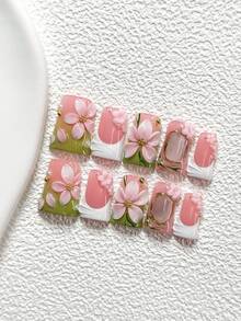 10件套春日樱花风手工美甲套装，包含假指甲贴纸、小花朵美甲装饰、手工粉色五瓣花美甲贴、绿白指甲油、3D立体浮雕梦幻美甲配件，内含指甲锉（1张果冻贴纸+1把指甲锉），三种尺寸可选：杏仁形、鸭嘴形、棺材形，适合春夏派对、日常佩戴、拍照、通勤等场合。 - 彩色 - 查看 15