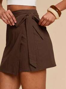 Elegante falda envolvente de mujer en color caqui, con diseño de lazo ajustable.Estilo minimalista y versátil, ideal para oficina y uso casual en verano, prenda chic y cómoda para cualquier ocasión. - Café integral - Ver 12