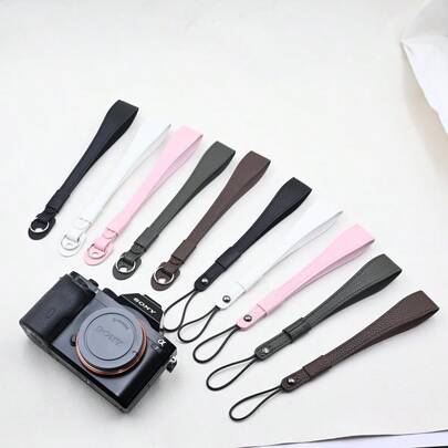 Một dây đeo cổ tay máy ảnh, phù hợp với máy ảnh DSLR, , , và máy ảnh không gương lật CMOS, được làm bằng da.