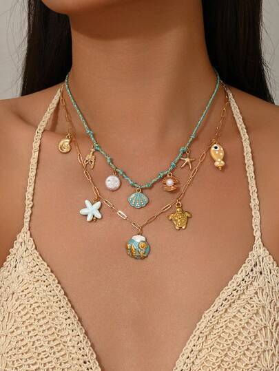 1 chiếc vòng cổ hai lớp phong cách Bohemian đại dương với mặt dây chuyền hình vỏ sò, sao biển, rùa, cá ngựa, ốc xà cừ, dây thừng bện màu xanh dương, thích hợp cho phụ nữ vào mùa hè, đi biển, dự tiệc, đám cưới.