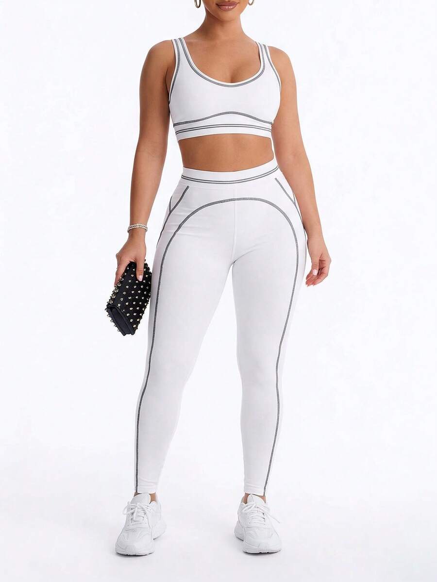 Bộ đồ thể thao nữ gồm áo tank top ngắn và quần legging phối màu tương phản, thích hợp cho tập luyện và thể dục. - trắng - Xem 1