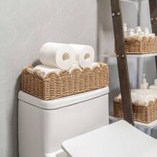 A Rattan Woven Storage Basket With A Wooden Handle, A Case For Keys And Cosmetics, A Hand-Woven Decorative Desktop Basket, A Hand-Woven Storage Basket With A Fan-Shaped Rim Made From Natural Materials. It Can Be Placed On The Top Shelf Of The Toilet Or Used As A Decorative Accessory In The Bathroom, Living Room, And Bedroom. - Brown - View 1