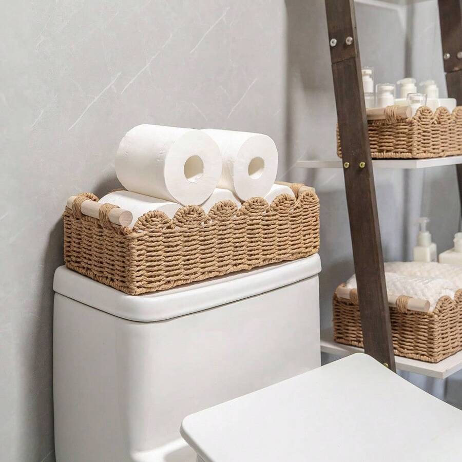 A Rattan Woven Storage Basket With A Wooden Handle, A Case For Keys And Cosmetics, A Hand-Woven Decorative Desktop Basket, A Hand-Woven Storage Basket With A Fan-Shaped Rim Made From Natural Materials. It Can Be Placed On The Top Shelf Of The Toilet Or Used As A Decorative Accessory In The Bathroom, Living Room, And Bedroom. - Brown - View 1
