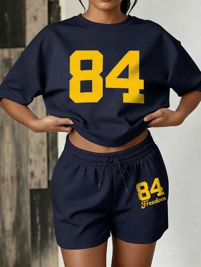 女士夏季两件套，纯色运动短裤搭配字母印花圆领T恤，休闲百搭，适合春夏、毕业典礼、假期、返校、街头风、宽松版型、户外活动、节日、派对等场合。