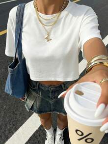 Áo thun crop top trắng dáng rộng phong cách Y2K tối giản dành cho nữ mùa hè - Áo dệt kim ngắn đơn giản, cổ tròn ôm sát, kiểu dáng cơ bản, dễ phối đồ, phù hợp cho mùa hè. - trắng - Xem 5