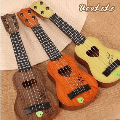 Đàn guitar mini, ukulele (tặng kèm miếng gảy). Chiếc đàn guitar mini này lý tưởng cho người mới bắt đầu và hoàn hảo để luyện tập ukulele. Được trang bị 4 dây đàn, nó tạo ra âm thanh trong trẻo và rõ ràng. Đây là lựa chọn quà tặng hoàn hảo – một món quà âm nhạc nhỏ gọn, thời trang và nhẹ. Được làm bằng nhựa bền, nhạc cụ đồ chơi acoustic này phù hợp cho: Các buổi tụ họp bạn bè, bất cứ ai đang tìm kiếm một món quà tiện lợi khi đi du lịch.