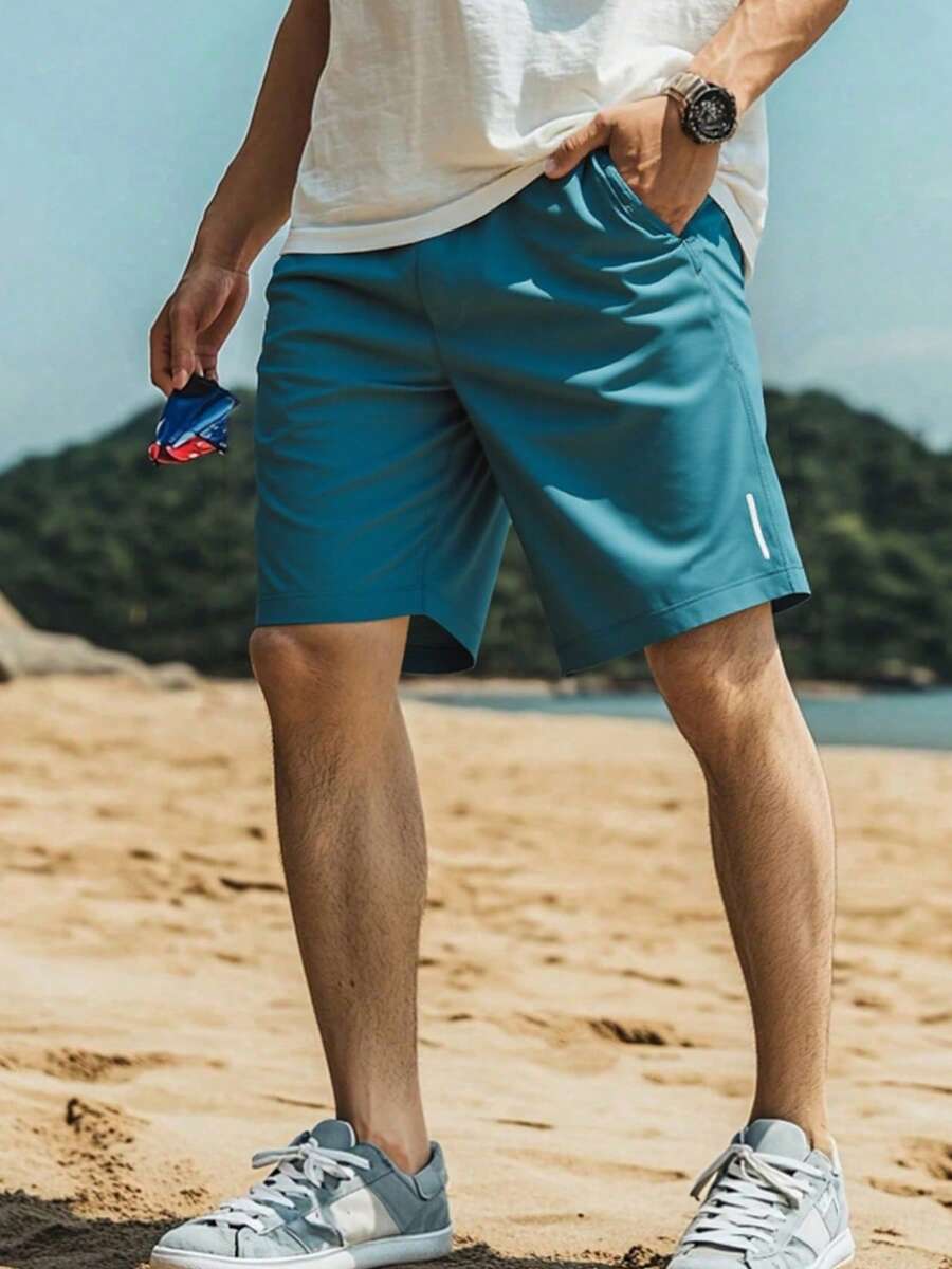 Quần short thể thao nam nhẹ, thoáng khí, nhanh khô với cạp chun và dây rút, phù hợp cho tập thể dục, chạy bộ và các hoạt động ngoài trời. Quần short nam mùa hè dáng rộng, thoải mái, chất liệu lụa băng, nhanh khô. - màu xanh lá - Xem 1