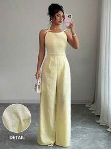 El mono de pierna ancha Elezga Elegante, con decoración de lazo en los hombros y estampado floral de margaritas en tela de brocado, es adecuado para el uso diario. - Rojo - Ver 8