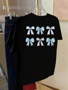Den senaste modellen från 2026: Kortärmad t-shirt med blå rosett fram och bak, modetryck med presentrosett - Dam vår/sommar t-shirt med tryck, modeplagg sommarkläder toppar - Vitt - Visa 8