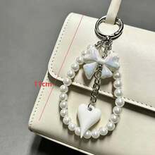 1个甜美奶油蝴蝶结珍珠链条包挂饰，创意少女百搭新款设计 - 彩色 - 查看 2