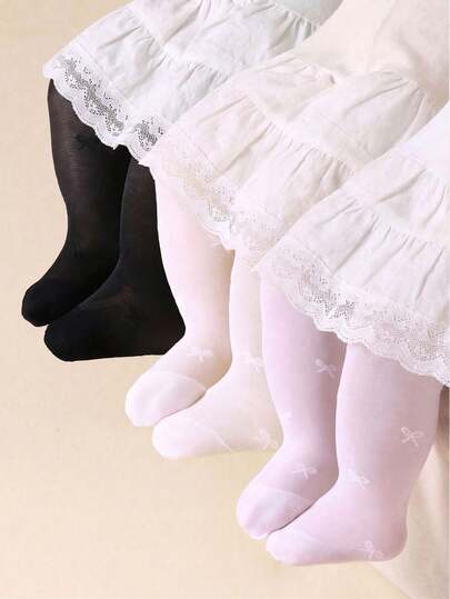 Bộ 3 quần legging màu đen, trắng và be cho bé gái, phù hợp cho bé từ 0-3 tuổi. Được làm từ vải nhung với họa tiết nơ, quả anh đào, hoa, chấm bi và trái tim, thoải mái và mềm mại. Kiểu dáng đơn giản, có thể phối với váy vào mùa hè, lý tưởng cho các bữa tiệc sinh nhật và làm quà tặng. Nhiều màu sắc tạo nên vẻ cổ điển và dễ phối đồ.