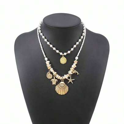 Mydear Bộ 2 vòng cổ hạt cườm nhiều lớp phong cách Bohemian với mặt dây chuyền hình sao biển, vỏ sò, ốc xà cừ, thích hợp cho phụ nữ đeo hàng ngày và đi nghỉ mát ở bãi biển.