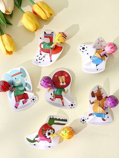 Tarjetas de decoración de piruleta con tema de fútbol y animales de dibujos animados, insertos de fiesta con temas deportivos de varios estilos, diseño de animales lindos pateando un balón, colores vibrantes, adecuado para fiestas con tema de fútbol, cumpleaños, eventos deportivos, para agregar una atmósfera divertida a postres y bebidas, elemento decorativo práctico para mejorar el ambiente de la fiesta.