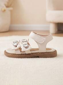 Sandalias planas de dedo abierto con hebilla ajustable y lazo con strass, adecuadas para la escuela, la playa y el estilo de princesa dulce, para niñas de 3 a 12 años, color beige - Albaricoque - Ver 5