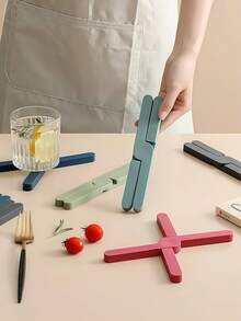 1 pieza Salvamanteles de silicona con forma de X resistente al calor, plegable, antideslizante, soporte para ollas y sartenes, posavasos de mesa de cocina, almohadilla para platos - Multicolor - Ver 3