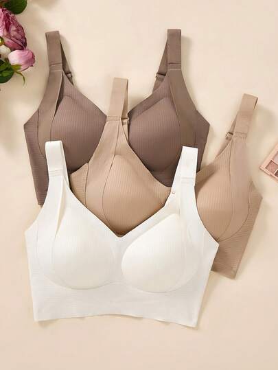 Set de 3 sujetadores deportivos sin costuras, transpirables y inalámbricos para mujeres - Cobertura total, antideslizante, con elevación y soporte, ajuste cómodo con detalles acanalados, mezcla de nailon y elastano, lavar a mano - unicolor elegantes