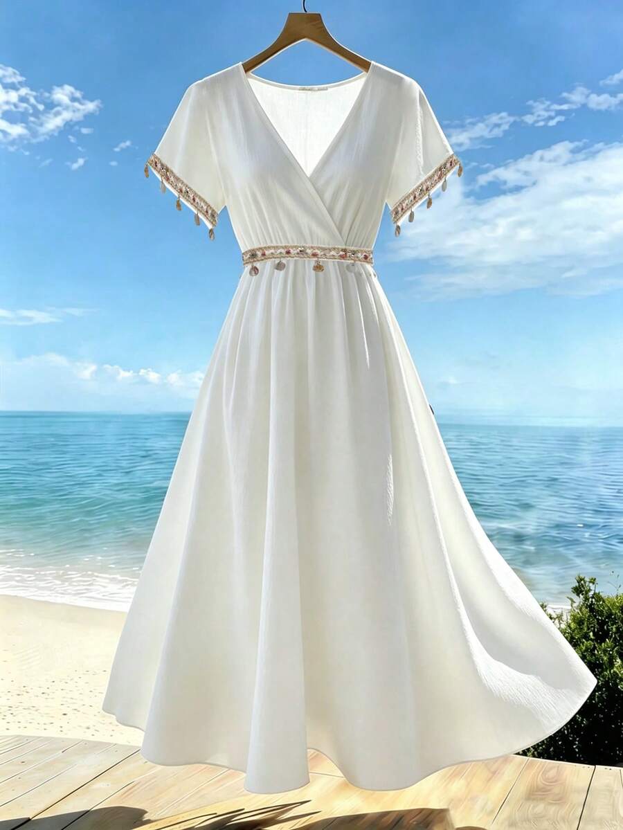 Đầm dài nữ thanh lịch, màu trắng, cổ chữ V, tay ngắn, dáng chữ A xòe rộng, điểm nhấn là chi tiết đính sequin và tua rua tương phản. - trắng - Xem 1