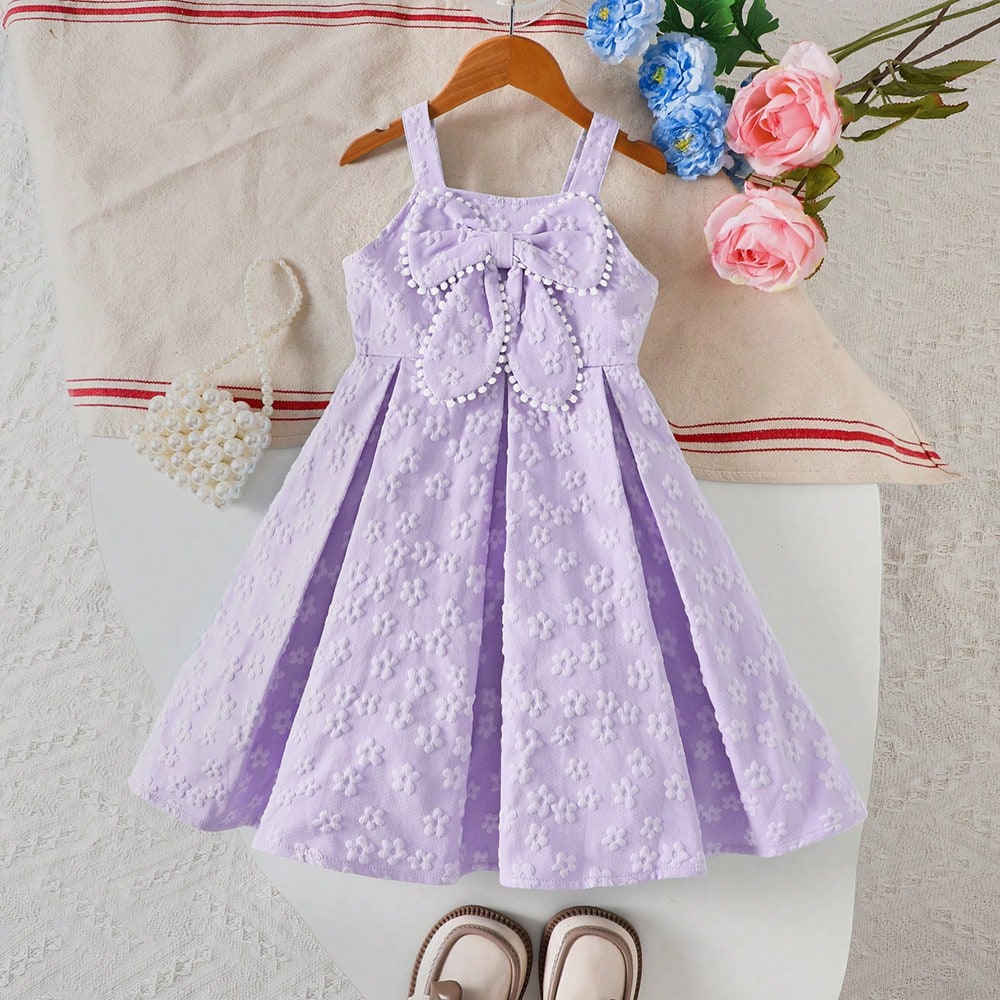 Vestido de princesa con tirantes finos, textura floral, pompones y gran lazo para niñas pequeñas en primavera/verano