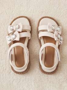 Sandalias planas de dedo abierto con hebilla ajustable y lazo con strass, adecuadas para la escuela, la playa y el estilo de princesa dulce, para niñas de 3 a 12 años, color beige - Albaricoque - Ver 4