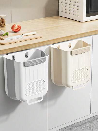 Thùng rác nhà bếp treo tường có thể gập lại, thiết kế kép: Được làm từ chất liệu PP dày dặn, có thể treo trực tiếp lên cửa tủ, giúp bạn vứt rác mà không cần cúi người; khi không sử dụng, có thể gập phẳng và treo lên cửa tủ mà không chiếm thêm không gian, cũng có thể dùng để đựng khăn giấy và bông tẩy trang.