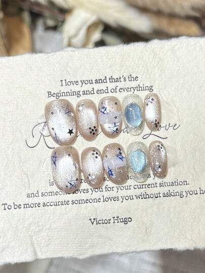 10pcs Y2K Starry Night Cat Eye Handmade Press On Nails, Nude Beige Nails Blue Star & Silver Glitter Fake Nails, Short Oval Nails Perfect For Summer Beach & Casual Wear, With Jelly Glue And Nail File, DIY Nail Art Supplies