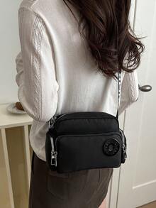 Mini porte-monnaie bandoulière, sac à bandoulière classique mode en couleur unie en nylon avec décoration de lettre. Fermeture éclair, sac décontracté multi-poches, convient pour les sports de plein air, les voyages, les courses, les déplacements, les fêtes, les sorties. Compact et portable. - Noir - Voir 4