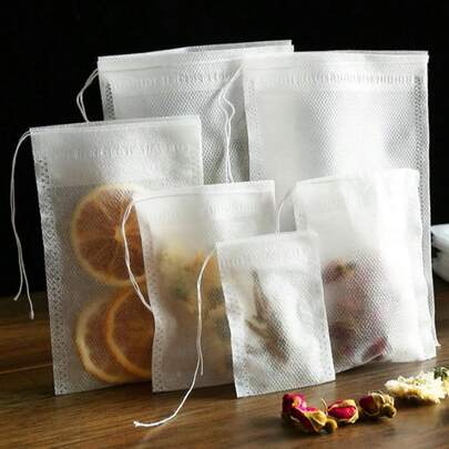 100 pakjes van 7 cm x 9 cm non-woven theezakjes, theezakjes (zonder thee), kruidentheezakjes, afgesloten met touwtjes voor eenmalig gebruik, multifunctioneel keukenfilter, geschikt voor thee, kruiden en fijne stoffen - zeer geschikt voor koken, traditionele Chinese geneeskunde en bottenbouillon - keukenaccessoires, theezakjes met trekkoord/eenmalig gebruik/limonadezakjes voor het zetten van thee, keukengereedschap, kleuren en stijlen zijn willekeurig