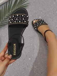 1 đôi sandal quai chữ T màu be đính ngọc trai và đá pha lê, sandal đế bằng sang trọng, chống trơn trượt, phù hợp cho các bạn tuổi teen dự tiệc và mặc thường ngày vào mùa hè. - màu đen - Xem 2