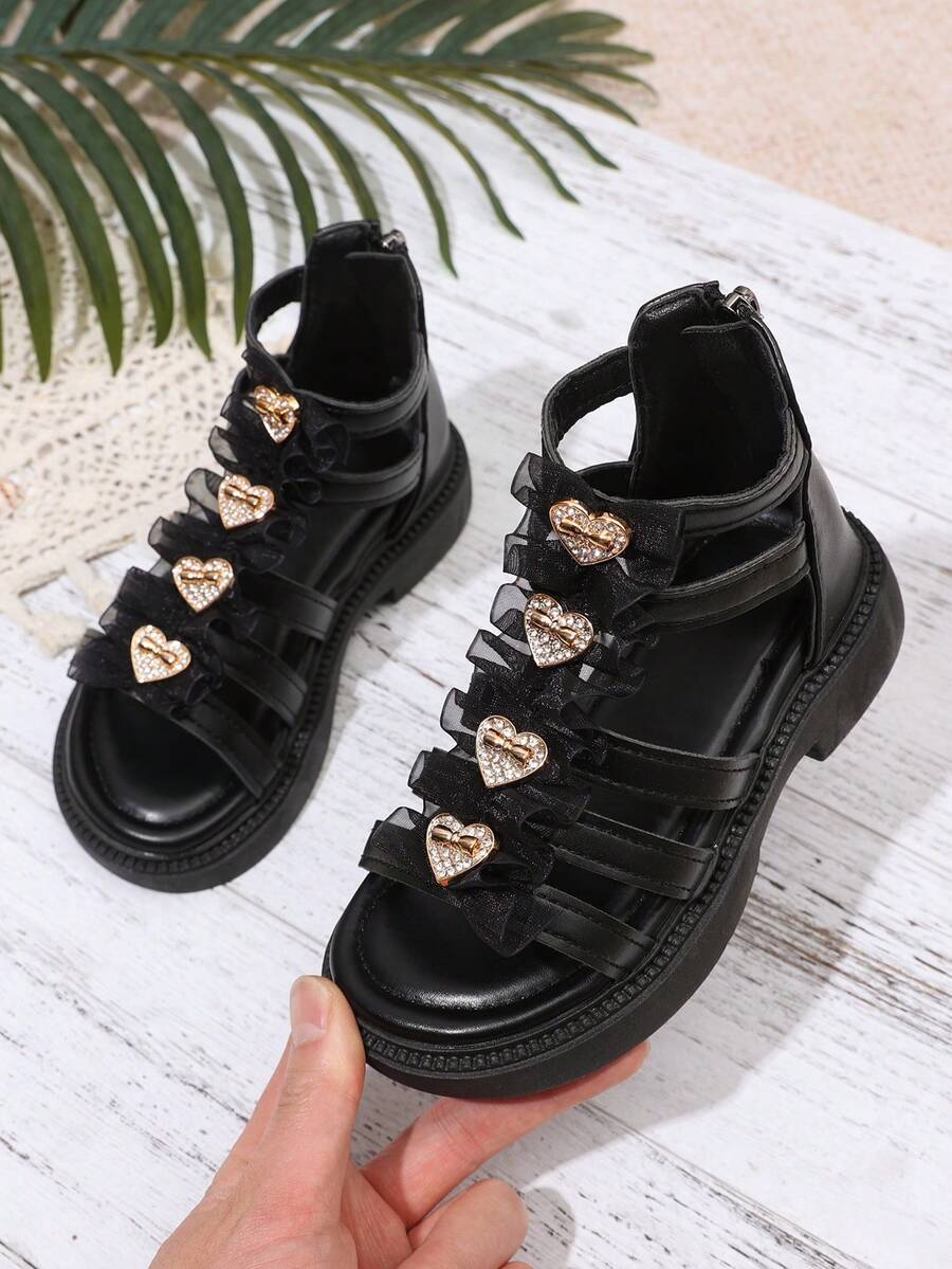 1 Pair Girls' Roman Sandals, Solid Color Soft Multi-Layer Criss-Cross Straps + Shiny Heart-Shaped Rhinestone Buckle Decor, Round Toe Open Toe Elastic Non-Slip Platform Sole, Heel Zipper Design, Fashion Sweet Princess High-Top Sandals, Suitable For 3-12 Years Old Girl Students Daily, School, Festival, Performance, Travel, Vacation, Spring/Summer New Arrival - Black - View 1
