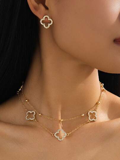 Bộ trang sức cổ điển, đa năng, thanh lịch, mạ vàng sáng bóng hình cỏ bốn lá rỗng, gồm dây chuyền và bông tai, dành cho nữ.