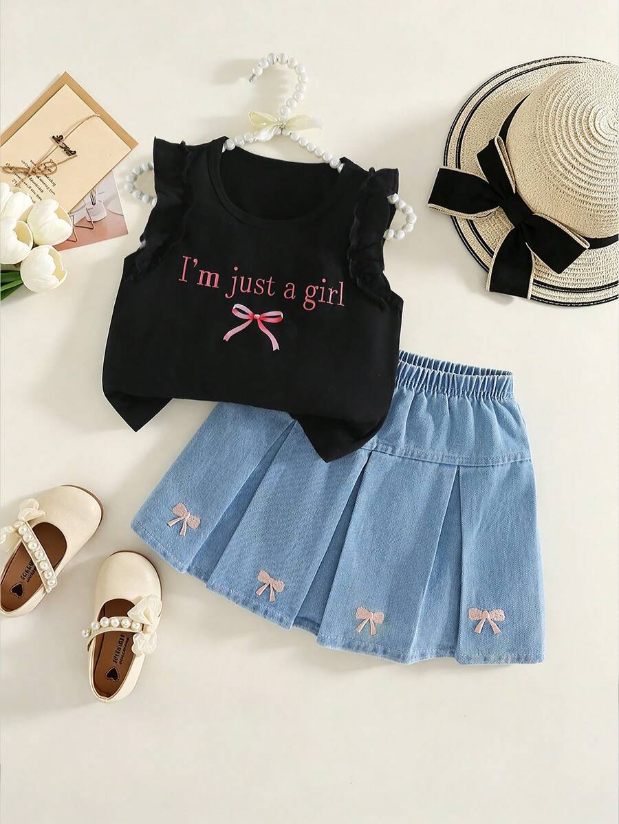 Bộ đồ liền thân cho bé gái: Áo thun cổ tròn tay phồng ôm sát in chữ và nơ, kèm chân váy xếp ly chữ A cạp chun. - màu đen - Xem 1
