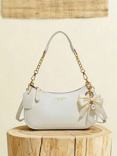This Women's Shoulder Bag Is Made Of Solid Color PU Material, Decorated With Letter Accents, Bow, And Pearl Pendant, Exuding A Fashionable Vibe. The Bag Features A Zipper And Metal Chain Design, Making It Stylish And Versatile. It Can Be Easily Worn Across The Body To Elevate Your Overall Look. The Spacious Interior Can Accommodate Daily Essentials Like Lipstick, Keys, Cosmetics, Etc., Suitable For Commuting, Outings, Dates, Shopping, And Various Everyday Occasions For Women., Cream Bag