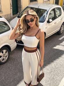 Bộ đồ nữ thanh lịch gồm 2 mảnh: áo croptop không dây và quần ống rộng suông, được làm từ chất liệu không co giãn, phù hợp cho các bữa tiệc và những dịp thường ngày. Mùa hè. - Màu be - Xem 5