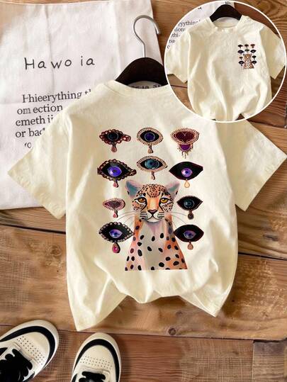 Áo thun tay ngắn cổ tròn cỡ lớn với họa tiết da báo và hình mắt độc đáo, phong cách thường ngày.